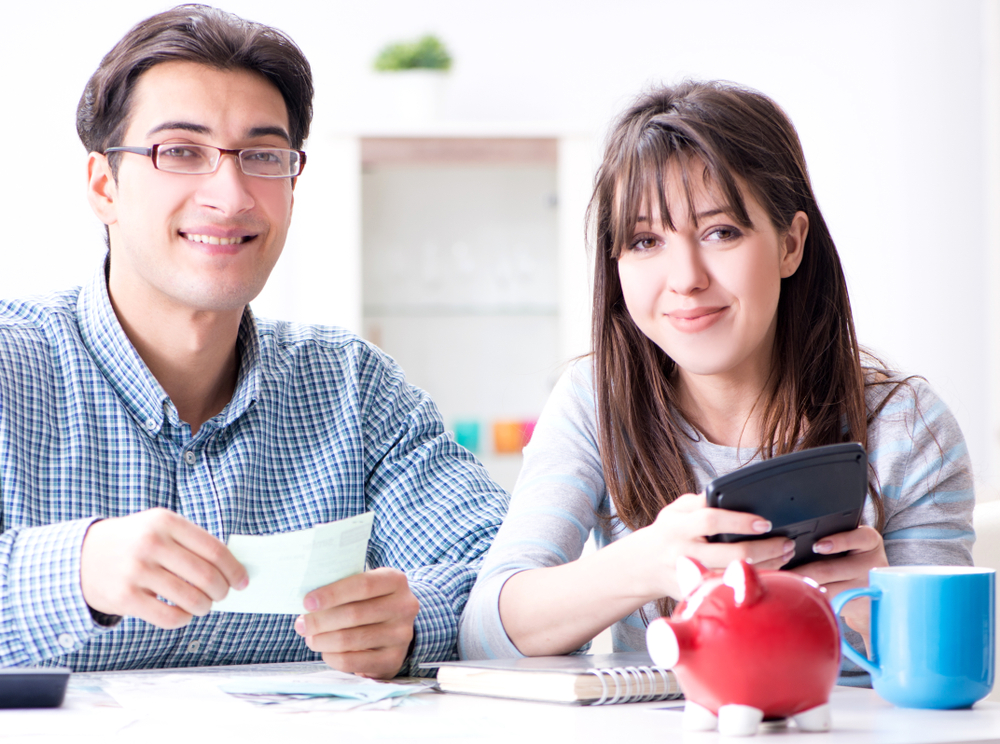 Two people sitting at a table Description automatically generated